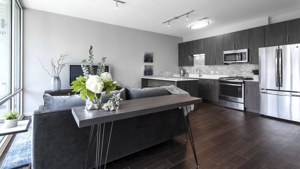 Spacious living room with modern decor in Luxe on Chicago Apartments