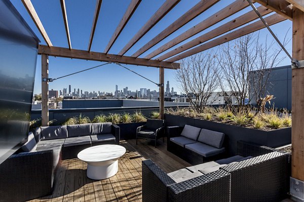 Elegant rooftop deck with scenic city views at Luxe on Chicago Apartments, perfect for relaxation and social gatherings