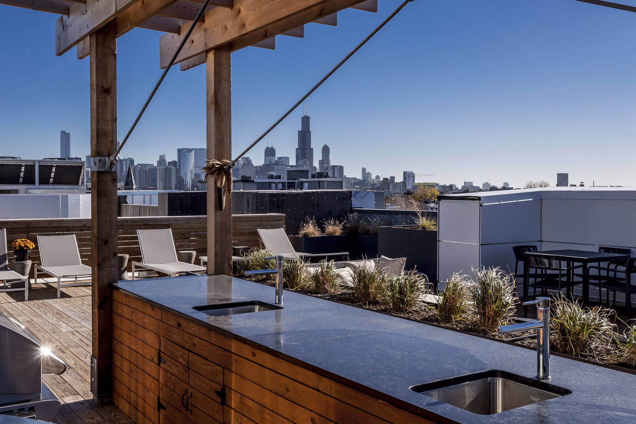 Luxurious rooftop deck with city views at Luxe on Chicago Apartments