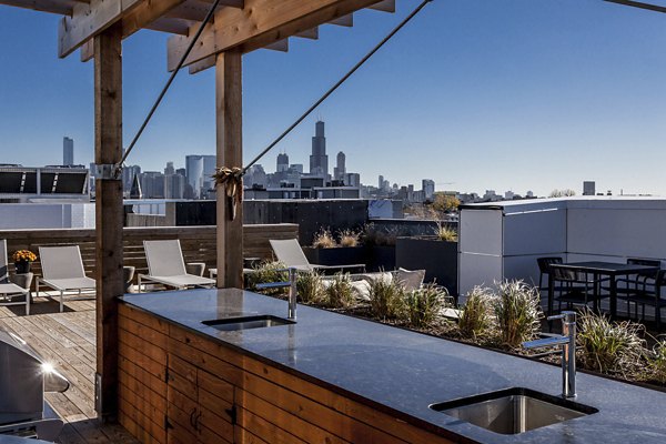 Luxurious rooftop deck with city views at Luxe on Chicago Apartments