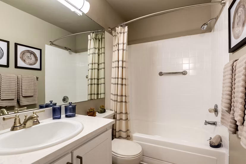 Bedroom featuring elegant design and cozy furnishings at Reflections on 92nd Apartments