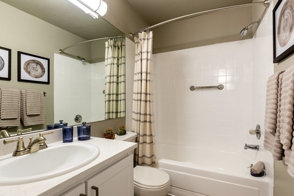 Bedroom featuring elegant design and cozy furnishings at Reflections on 92nd Apartments