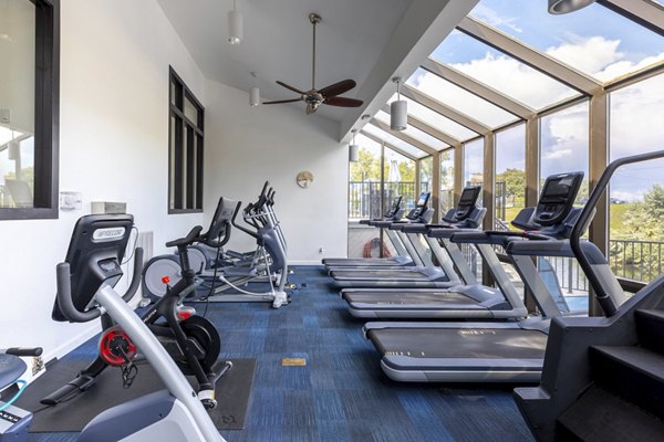 State-of-the-art fitness center with modern equipment at Reflections on 92nd Apartments