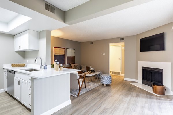 Spacious living room with modern decor at Reflections on 92nd Apartments