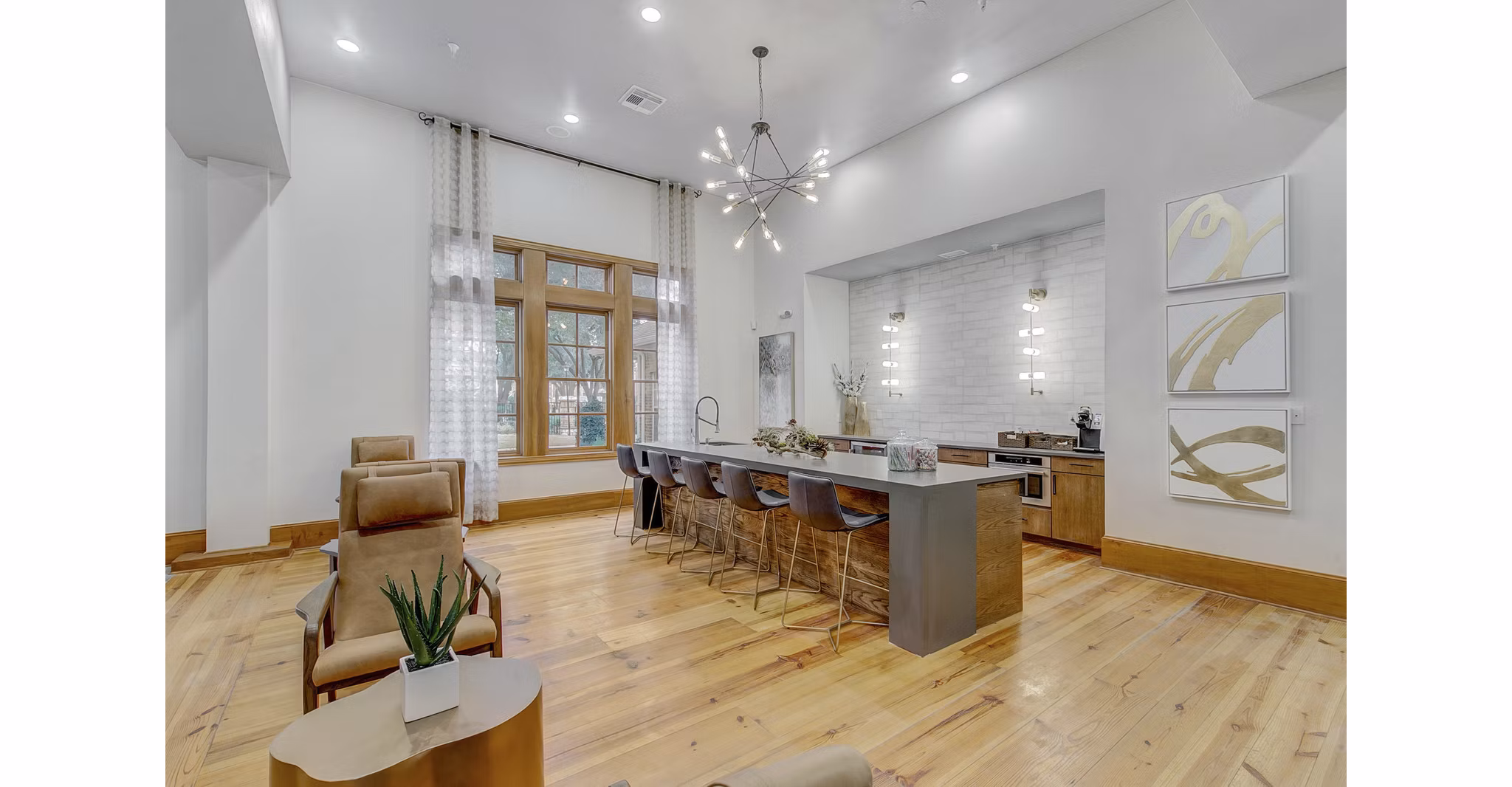 Modern clubhouse with lounge seating and fireplace at St Marin Apartments