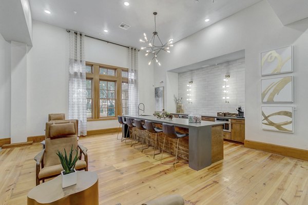 Modern clubhouse with lounge seating and fireplace at St Marin Apartments