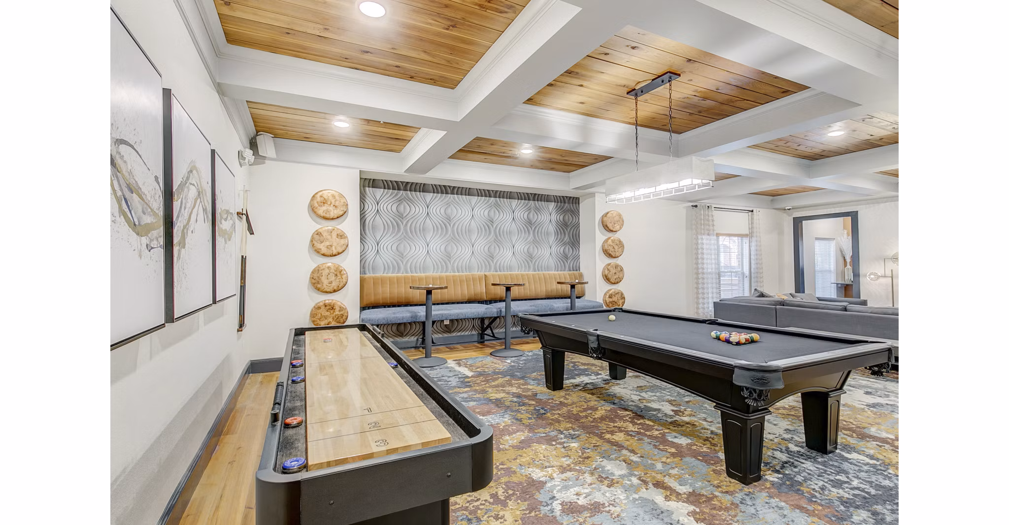 Game room featuring a pool table and shuffleboard at luxury apartments