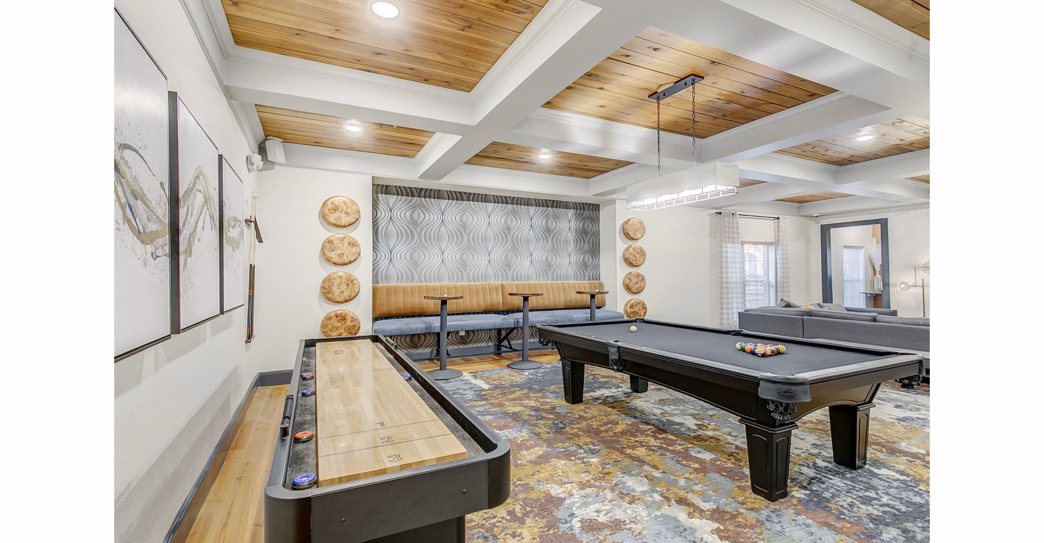Game room featuring a pool table and shuffleboard at luxury apartments