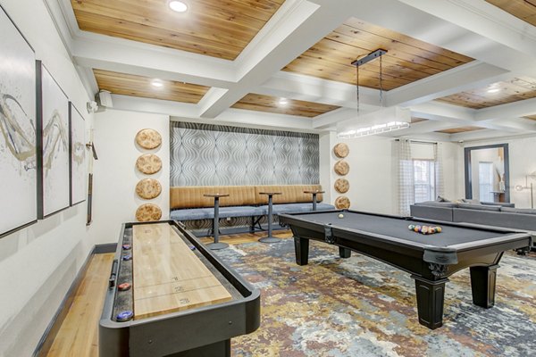 Game room featuring a pool table and shuffleboard at luxury apartments