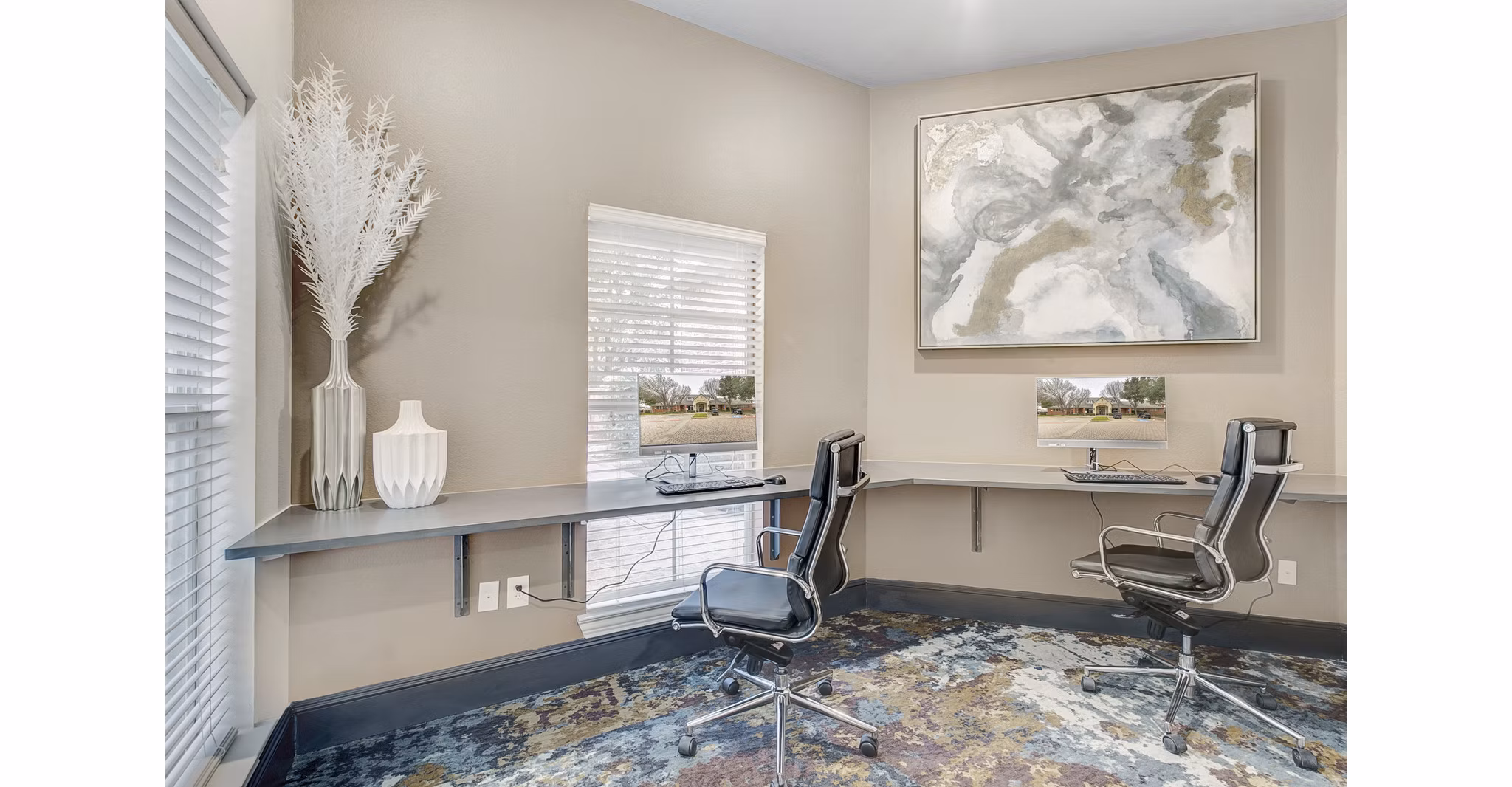 Business center with modern workstations at St Marin Apartments in Greystar community