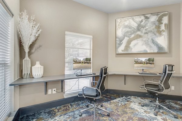 Business center with modern workstations at St Marin Apartments in Greystar community