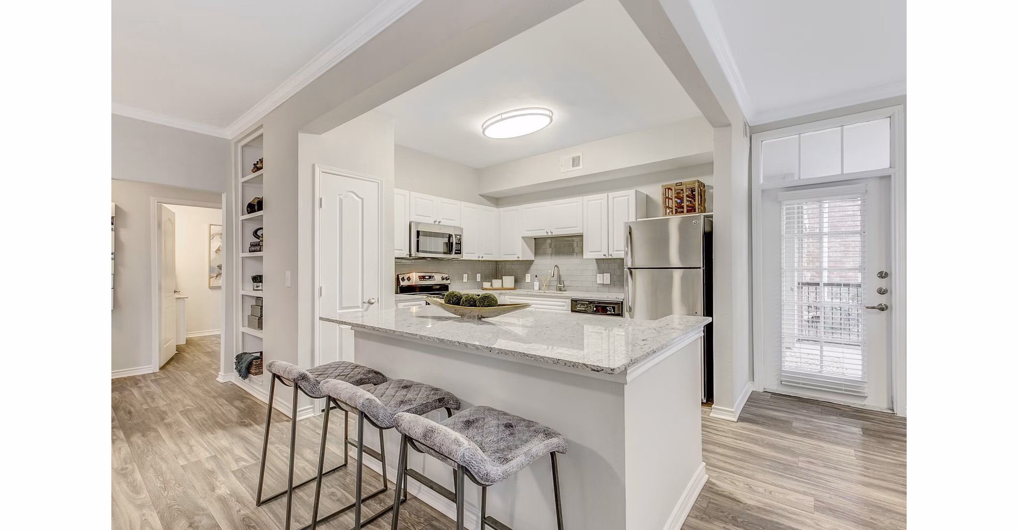 Modern kitchen with stainless steel appliances at St Marin Apartments, luxury living by Greystar