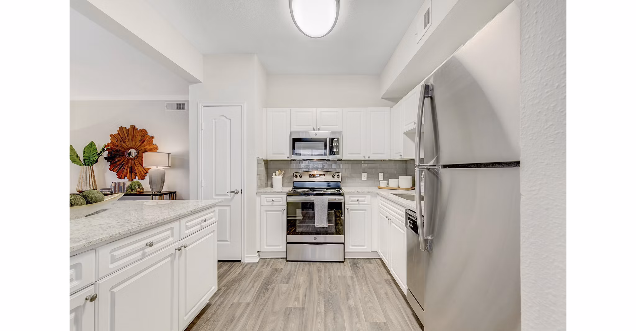 Modern kitchen featuring sleek countertops and stainless steel appliances at St Marin Apartments, luxury living by Greystar