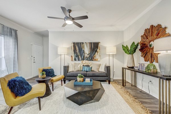 Spacious living room with modern furnishings in St Marin Apartments