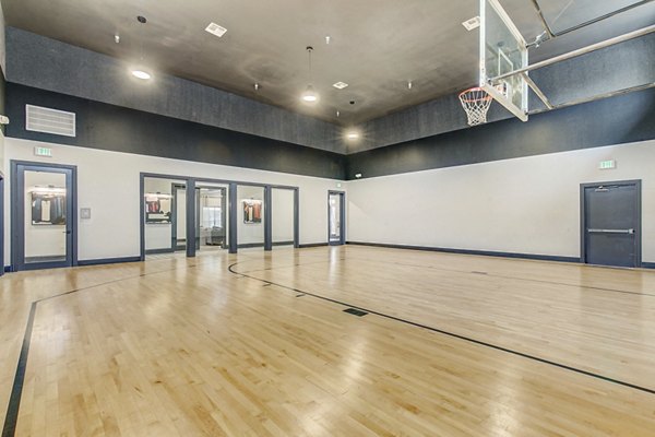 Outdoor sport court at St Marin Apartments offering tennis and basketball facilities for active residents