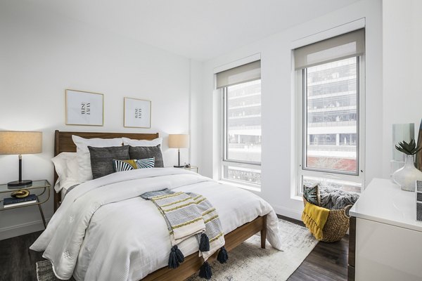 Modern bedroom with stylish decor at Lantera at Boston Landing Apartments