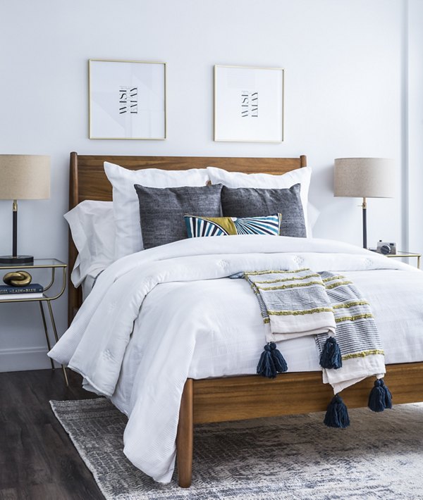 Cozy bedroom with stylish decor at Lantera at Boston Landing Apartments
