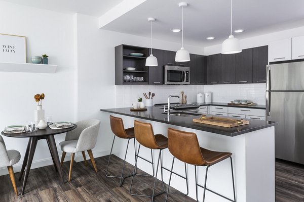 Lantera at Boston Landing: Elegant dining room with modern furnishings in luxury apartments