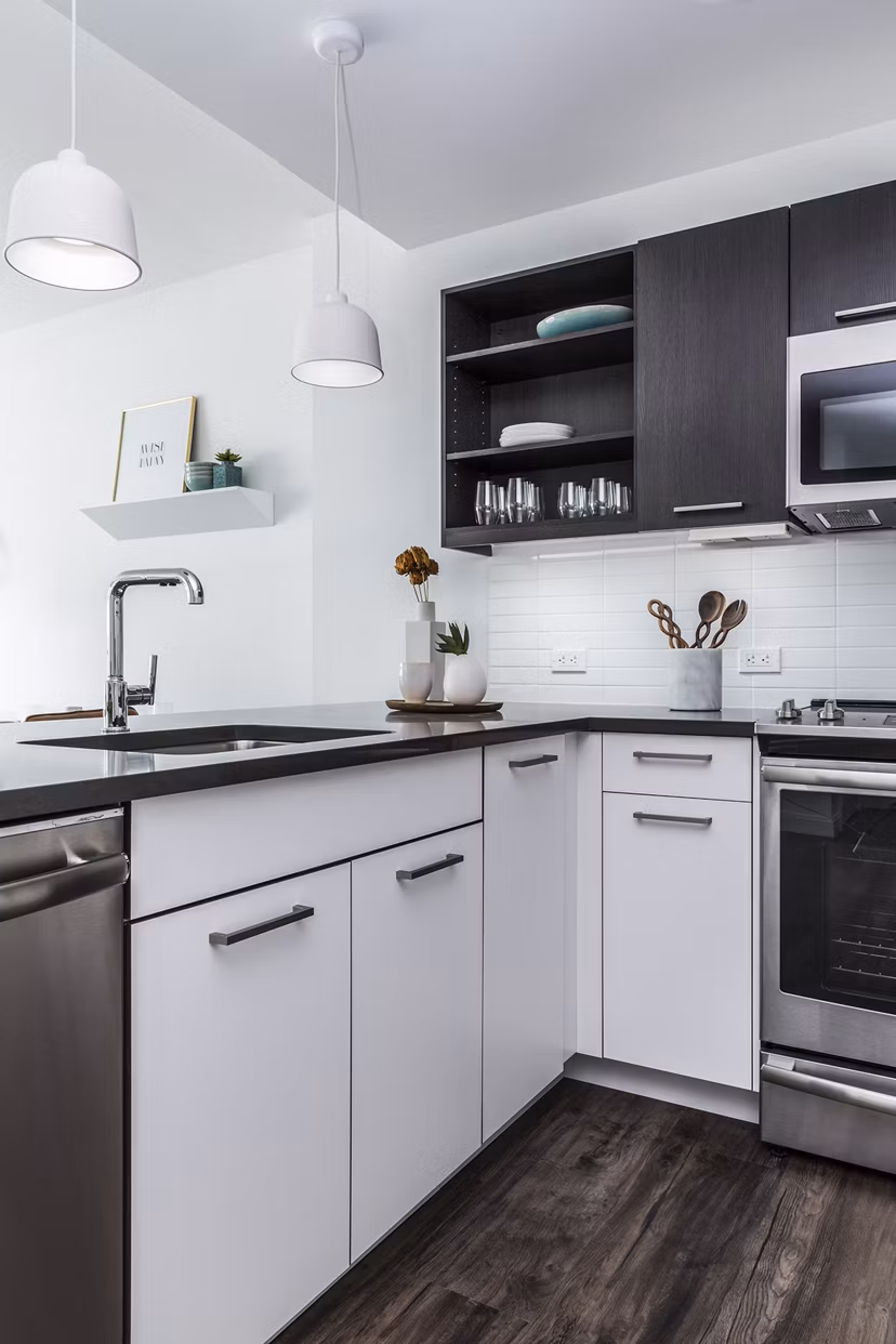 Modern kitchen with sleek cabinetry and stainless steel appliances in Lantera at Boston Landing Apartments Perfect for culinary enthusiasts