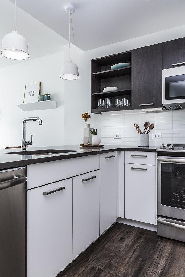 Modern kitchen with sleek cabinetry and stainless steel appliances in Lantera at Boston Landing Apartments Perfect for culinary enthusiasts