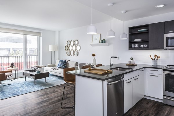 Sleek kitchen with modern appliances in Lantera at Boston Landing Apartments, luxury homes near downtown