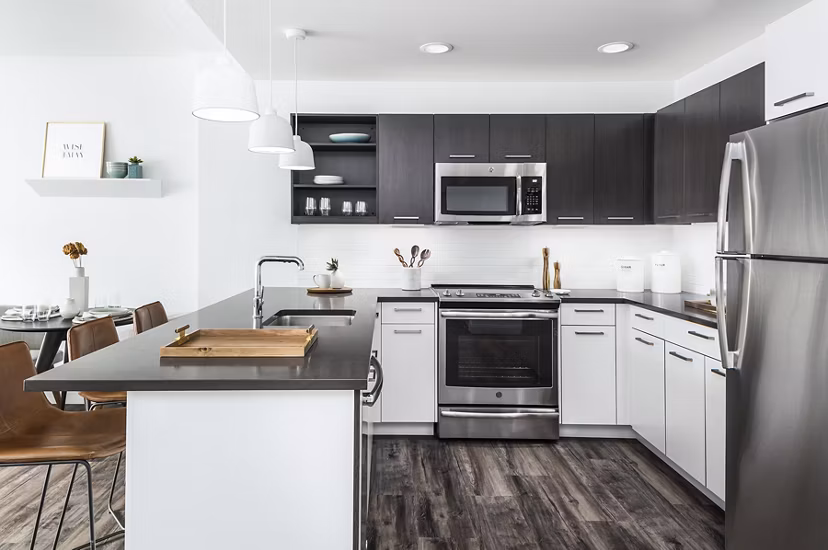 Modern kitchen with stainless steel appliances at Lantera at Boston Landing Apartments