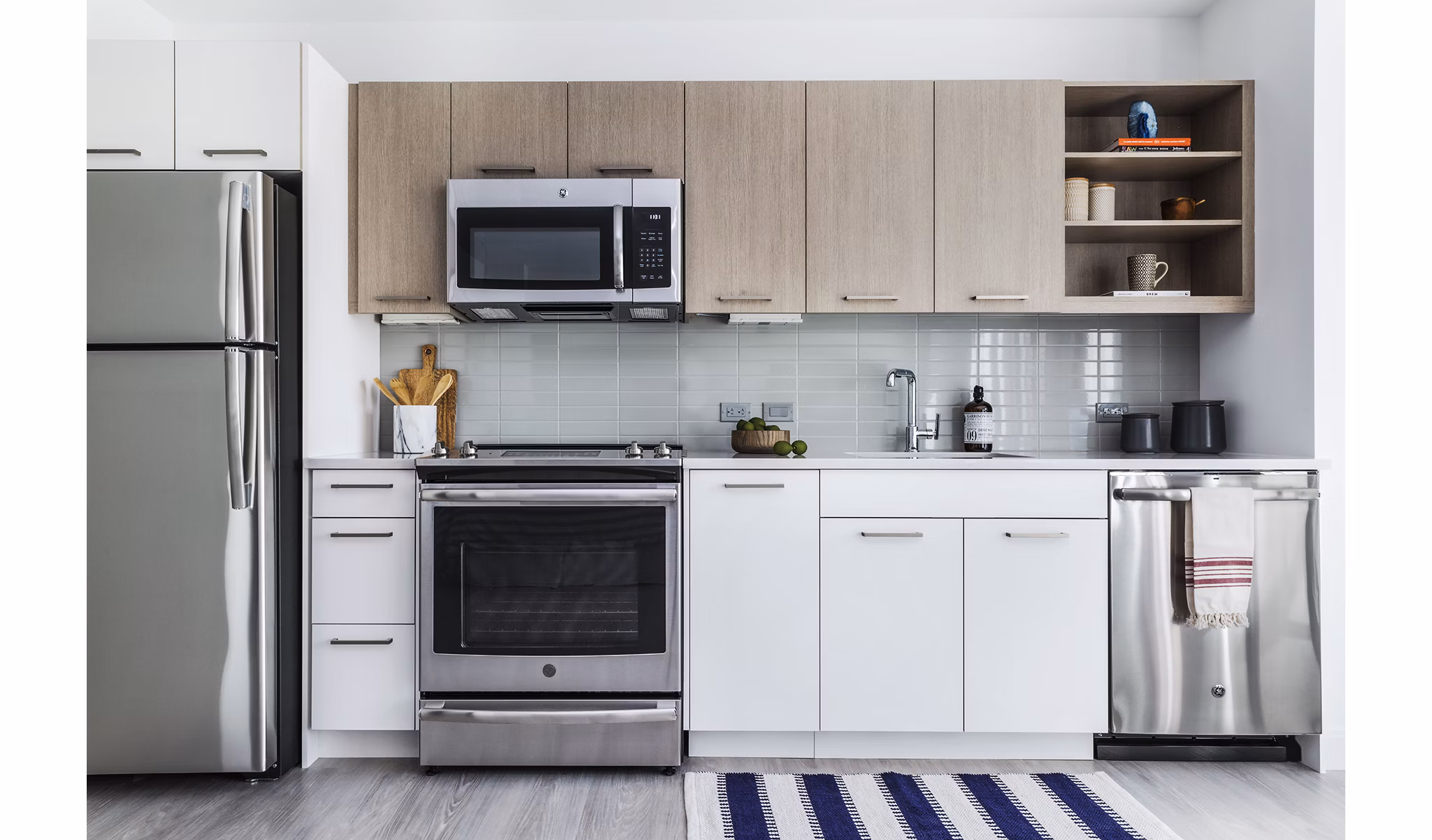 Modern kitchen with stainless steel appliances at Lantera at Boston Landing Apartments