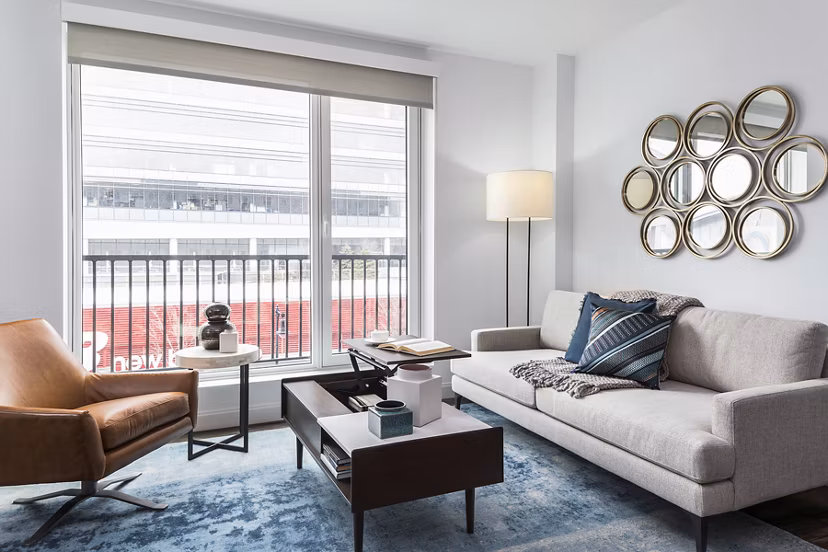 Spacious living room with modern furnishings at Lantera at Boston Landing Apartments
