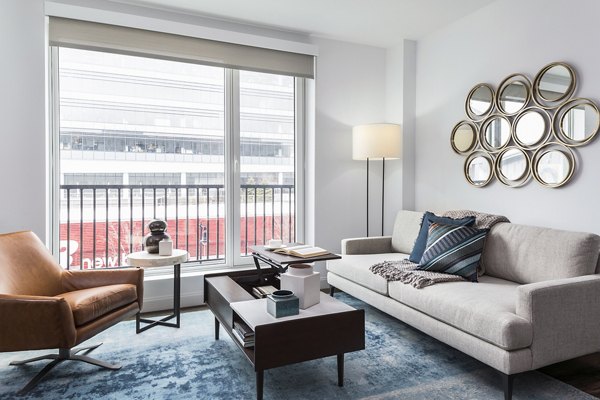 Spacious living room with modern furnishings at Lantera at Boston Landing Apartments