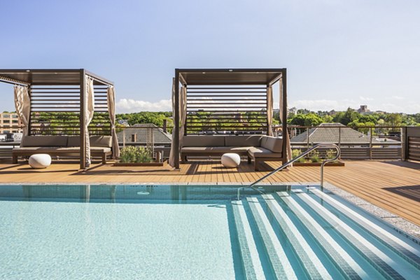Rooftop pool with city views at Lantera at Boston Landing Apartments