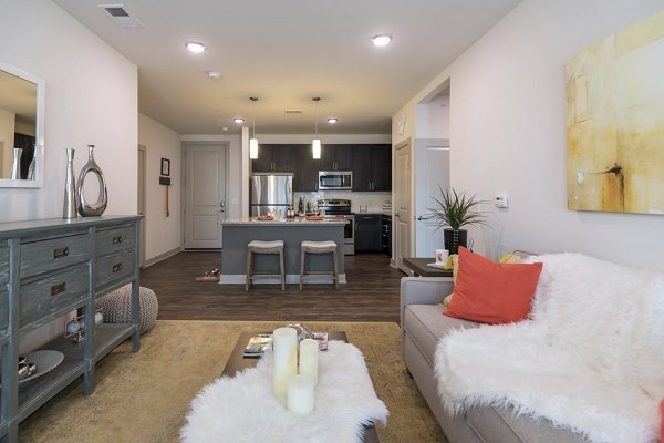 The Franklin at Crossroads: Cozy living room with modern decor and natural light