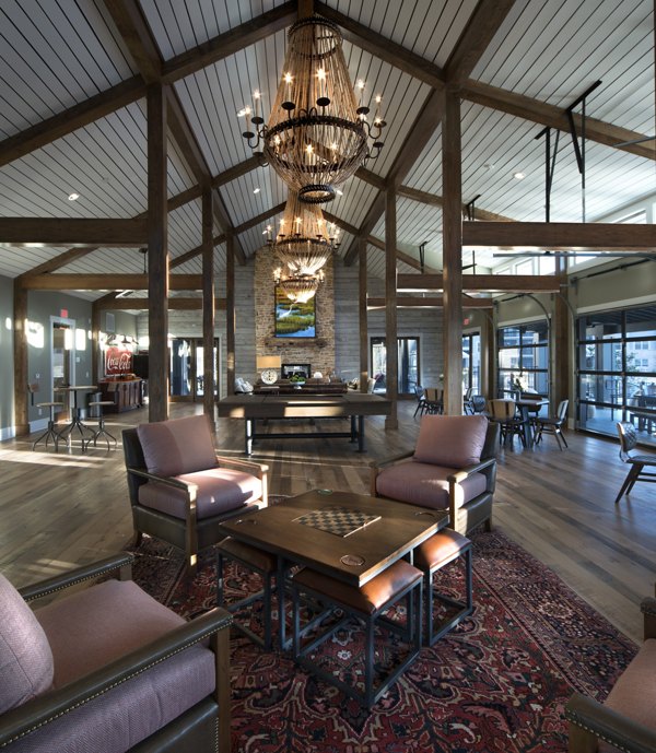 Elegant clubhouse at One Hampton Lake Apartments with luxury seating and modern design