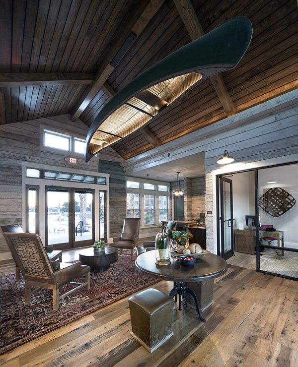 Clubhouse with modern lounging and recreational facilities at One Hampton Lake Apartments