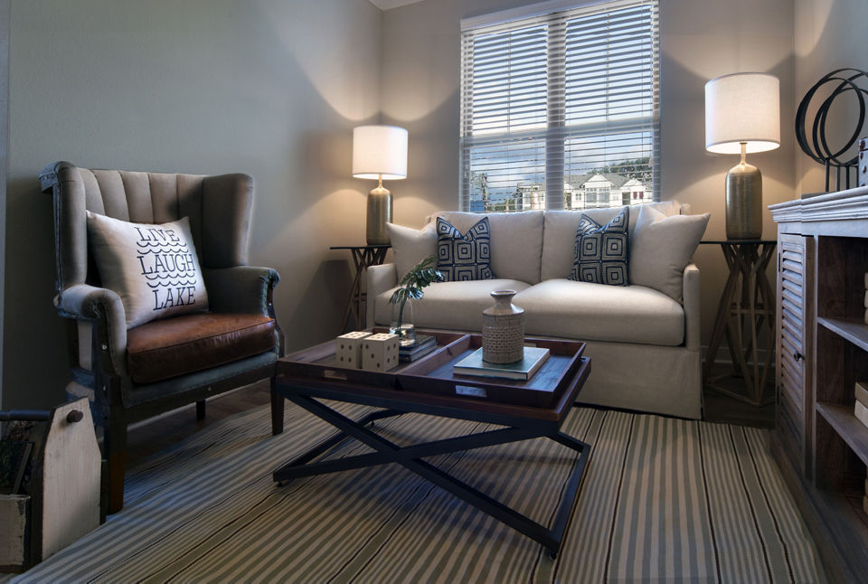Modern living room with stylish furnishings and natural light at One Hampton Lake Apartments