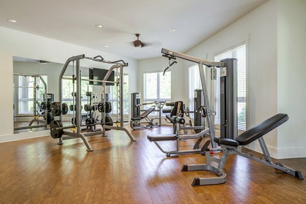 Modern fitness center with state-of-the-art equipment at Grand Oaks at Crane Creek Apartments, ideal for maintaining a healthy lifestyle