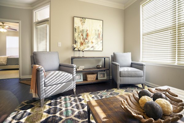 Spacious living room with modern decor at Grand Oaks at Crane Creek Apartments