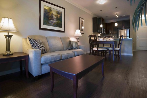 living room at Grand Oaks at Crane Creek Apartments
