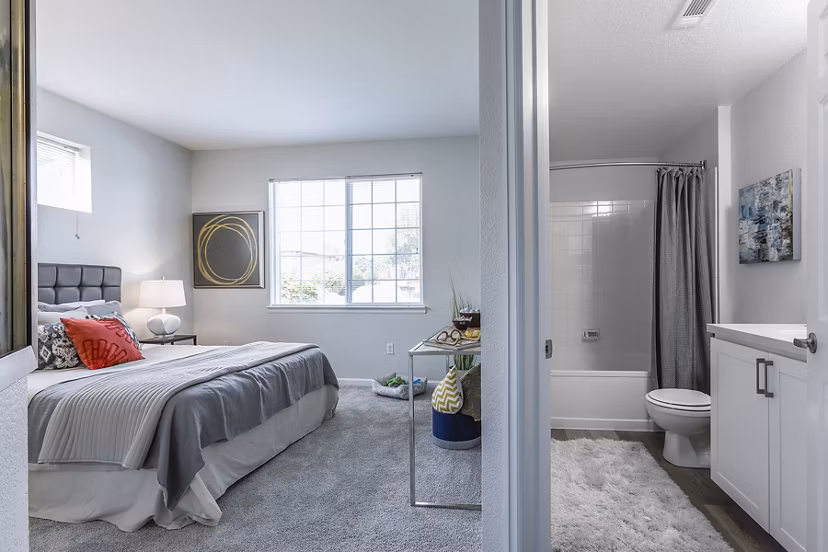 Bedroom featuring contemporary design and plush bedding at Avana Eastlake Apartments