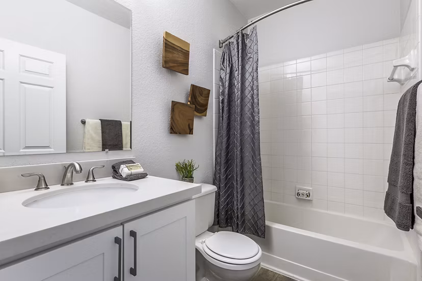 Bathroom with modern design features, including a double vanity and sleek finishes at Avana Eastlake Apartments