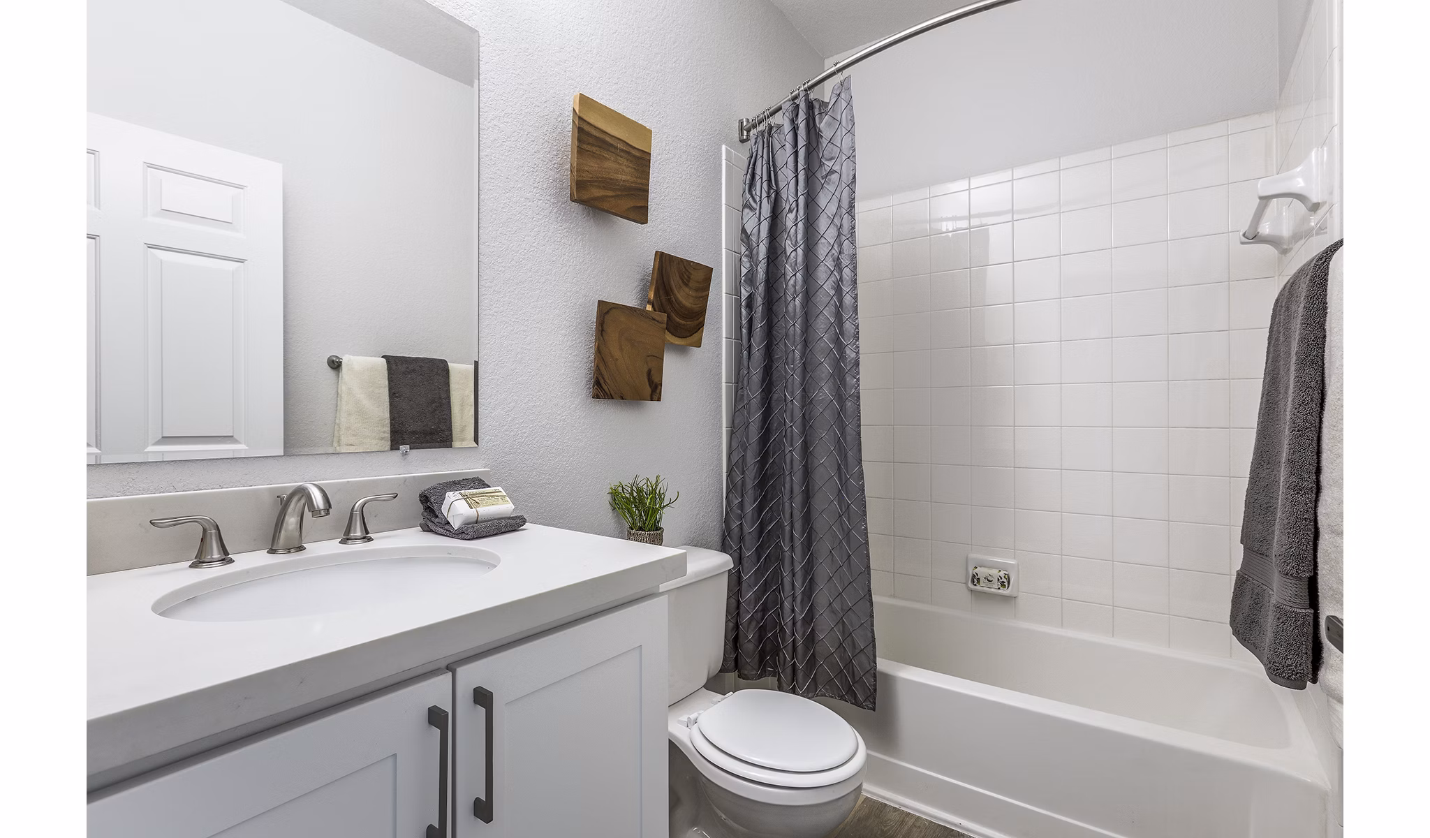 Bathroom with modern design features, including a double vanity and sleek finishes at Avana Eastlake Apartments