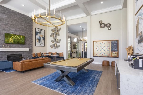 Clubhouse game room with billiards table at Avana Eastlake Apartments: Elegant space for relaxation and fun