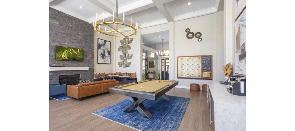 Clubhouse game room with billiards table at Avana Eastlake Apartments: Elegant space for relaxation and fun