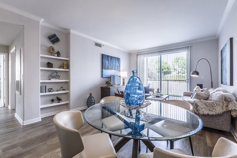 Dining room featuring sleek dining set and modern lighting in Avana Eastlake Apartments
