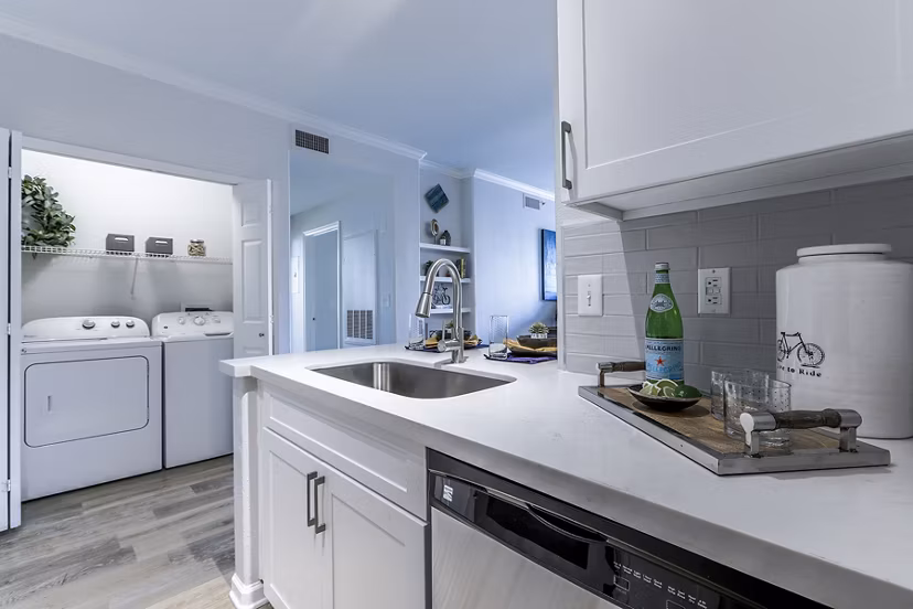 Kitchen featuring modern appliances and sleek cabinetry at Avana Eastlake Apartments