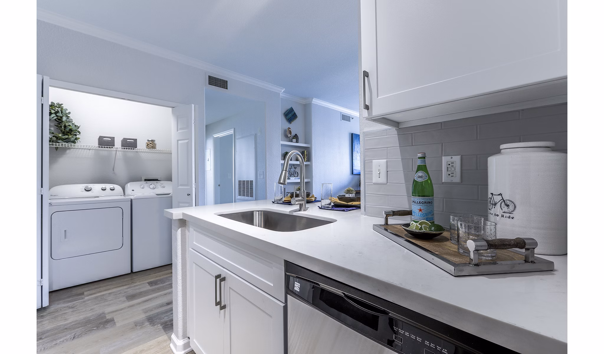 Kitchen featuring modern appliances and sleek cabinetry at Avana Eastlake Apartments