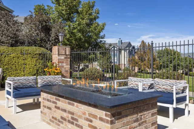 Cozy fire pit area at Avana Eastlake Apartments, a Greystar property