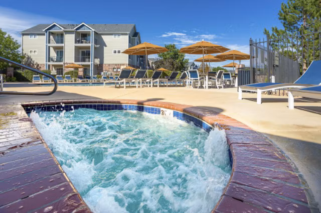 Hot tub with ambient lighting at Avana Eastlake Apartments for relaxation and leisure