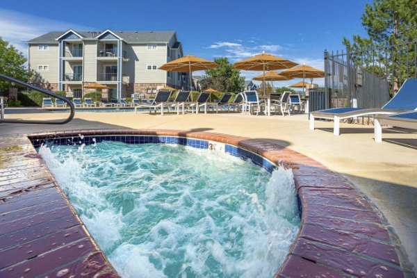 Hot tub with ambient lighting at Avana Eastlake Apartments for relaxation and leisure