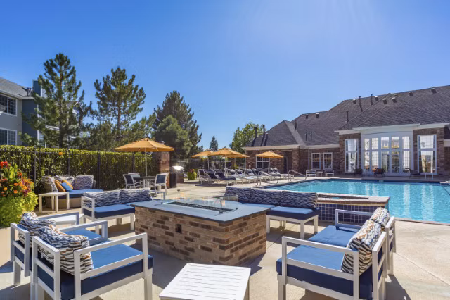 Cozy evening by the fire pit at Avana Eastlake Apartments, featuring comfortable seating and ambient lighting for a luxury outdoor experience