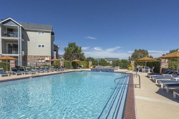 Resort-style pool with lounge chairs at Avana Eastlake Apartments